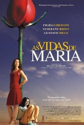 Contornos do Congresso Nacional sobre um céu azul. Duas mulheres encostadas em uma grande rosa vermelha. Abaixo, o texto: De quantas vidas você precisa para ser feliz. 